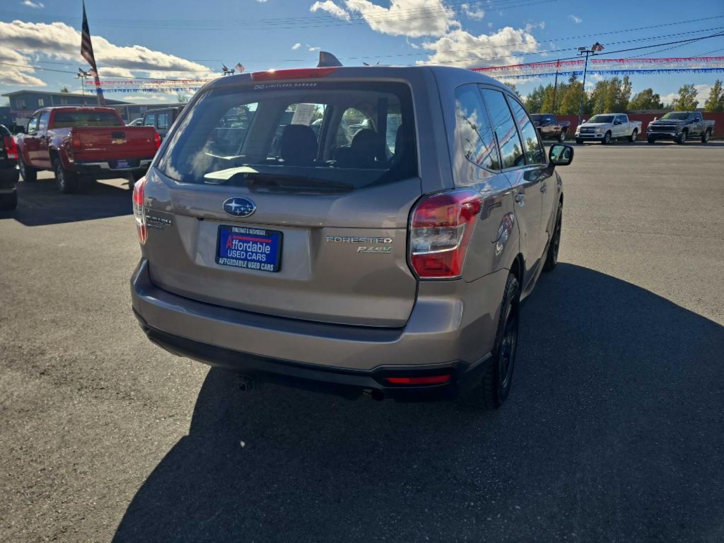 2016 BRONZE SUBARU FORESTER 2.5I (JF2SJAAC8GG) with an 2.5L engine, 6-Speed Manual transmission, located at 2525 S. Cushman, Fairbanks, AK, 99701, (907) 452-5707, 64.824036, -147.712311- Photo#2