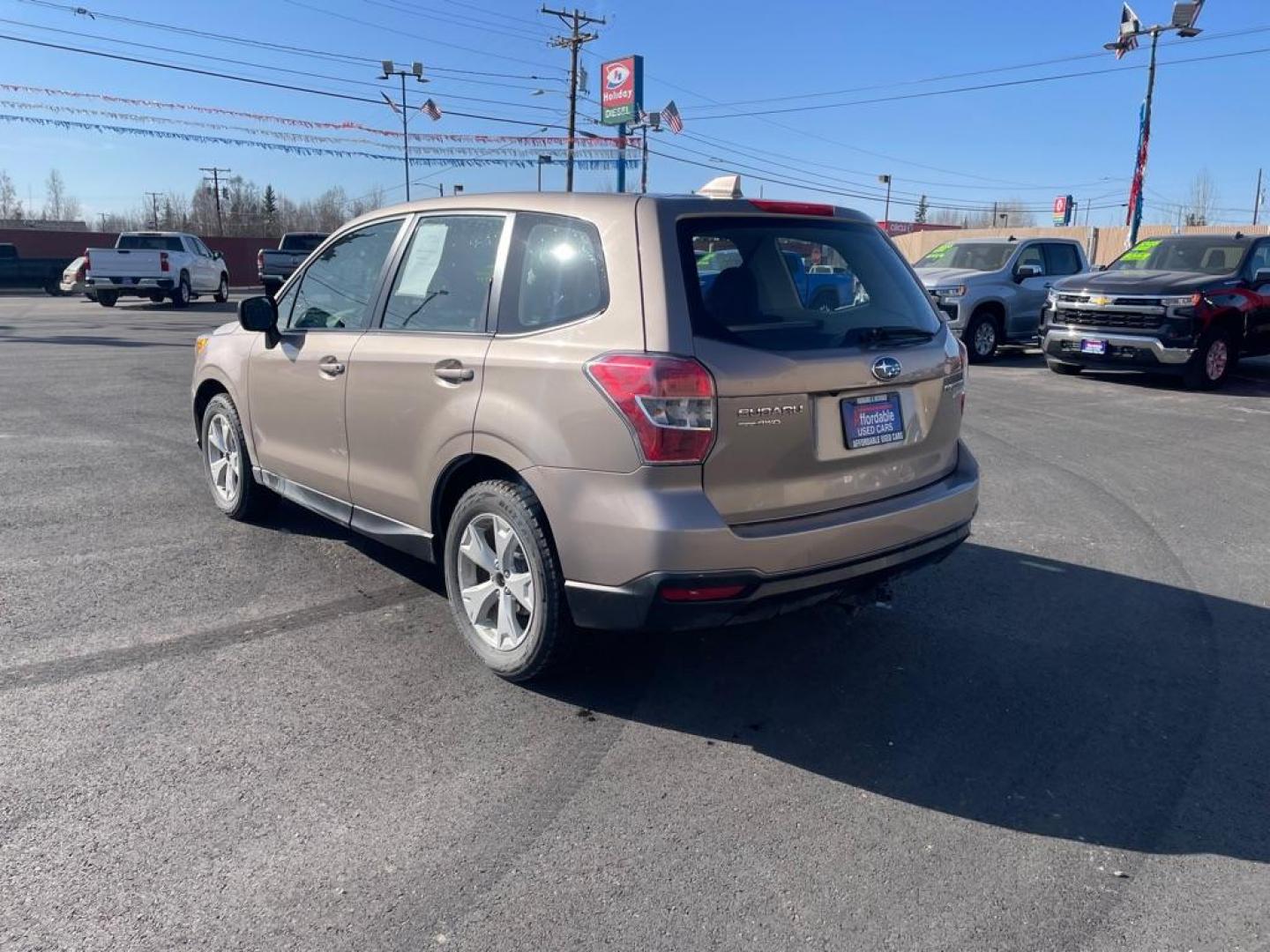 2016 BRONZE SUBARU FORESTER 2.5I (JF2SJAAC8GG) with an 2.5L engine, 6-Speed Manual transmission, located at 2525 S. Cushman, Fairbanks, AK, 99701, (907) 452-5707, 64.824036, -147.712311 - Photo#2