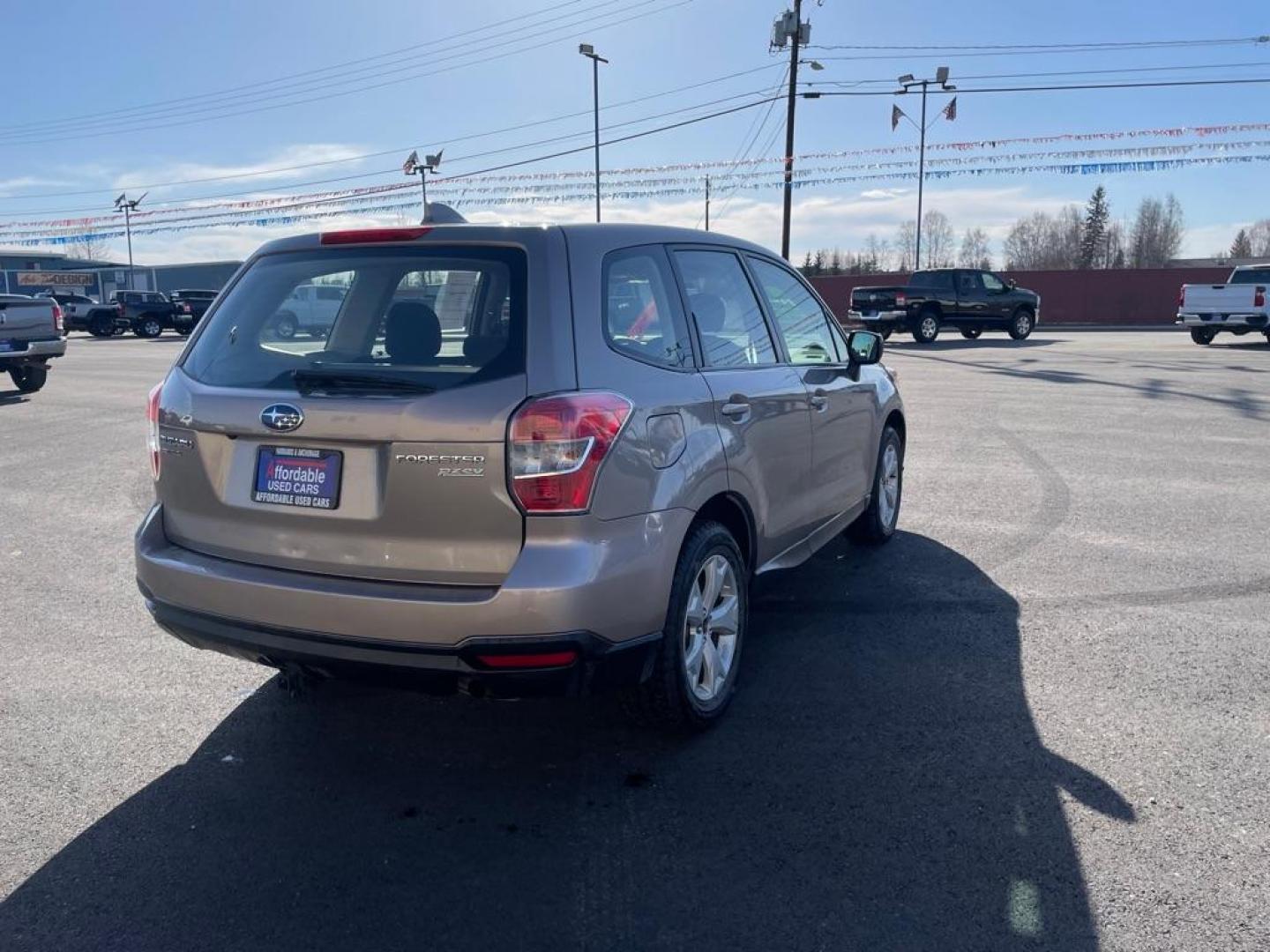 2016 BRONZE SUBARU FORESTER 2.5I (JF2SJAAC8GG) with an 2.5L engine, 6-Speed Manual transmission, located at 2525 S. Cushman, Fairbanks, AK, 99701, (907) 452-5707, 64.824036, -147.712311 - Photo#3