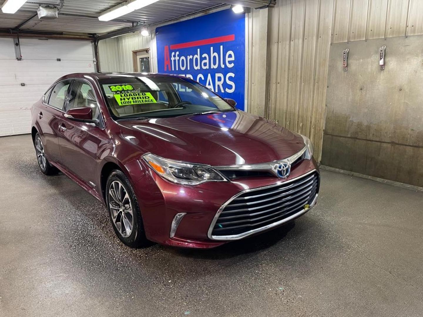 2016 MAROON TOYOTA AVALON HYBRID (4T1BD1EB1GU) with an 2.5L engine, Automatic transmission, located at 2525 S. Cushman, Fairbanks, AK, 99701, (907) 452-5707, 64.824036, -147.712311 - Photo#0