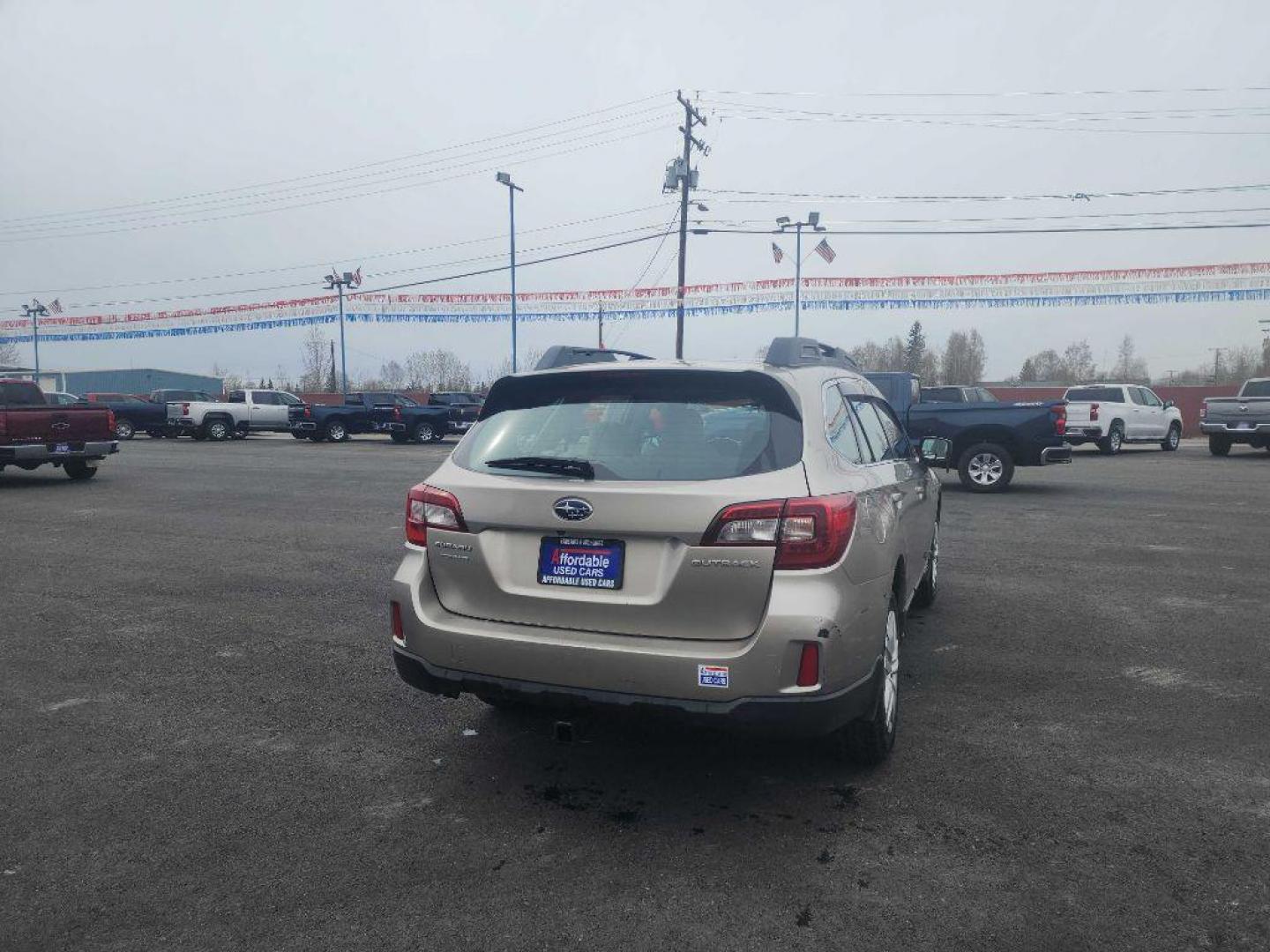 2015 GOLD SUBARU OUTBACK 2.5I (4S4BSBAC2F3) with an 2.5L engine, Continuously Variable transmission, located at 2525 S. Cushman, Fairbanks, AK, 99701, (907) 452-5707, 64.824036, -147.712311 - Photo#2