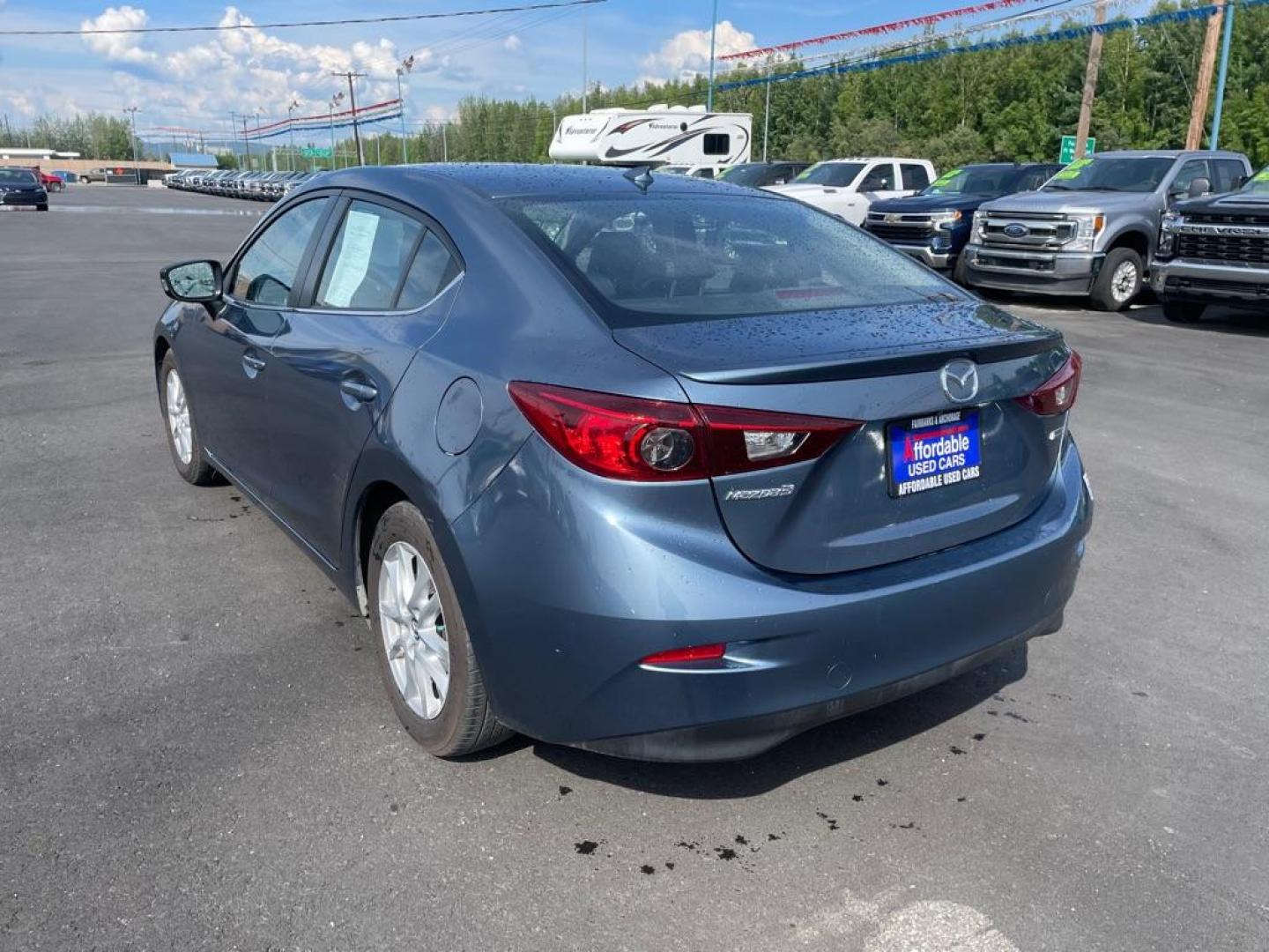 2016 BLUE MAZDA 3 GRAND TOURING (JM1BM1X77G1) with an 2.0L engine, Automatic transmission, located at 2525 S. Cushman, Fairbanks, AK, 99701, (907) 452-5707, 64.824036, -147.712311 - Photo#2