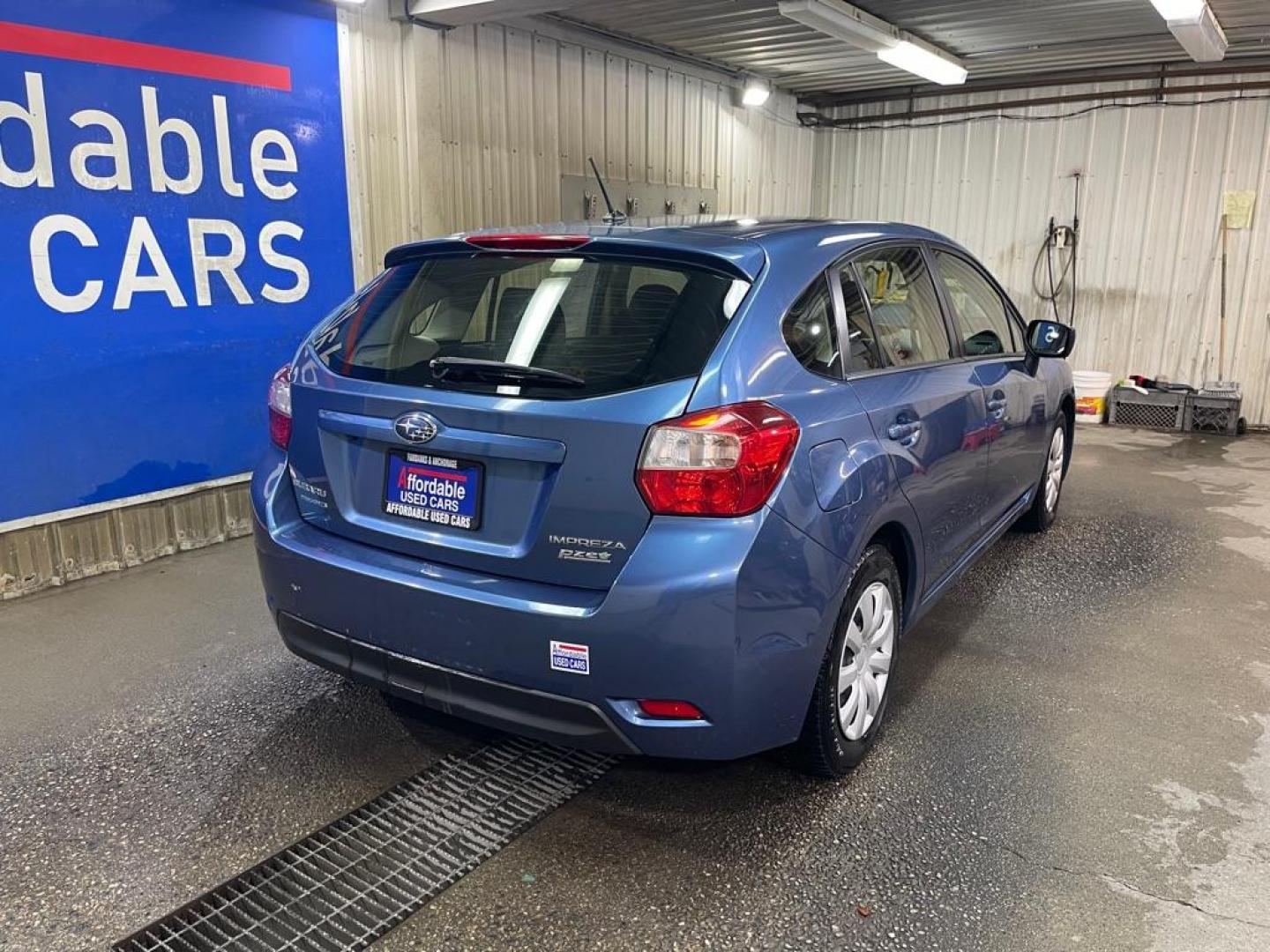 2015 BLUE SUBARU IMPREZA (JF1GPAA60FH) with an 2.0L engine, Continuously Variable transmission, located at 2525 S. Cushman, Fairbanks, AK, 99701, (907) 452-5707, 64.824036, -147.712311 - Photo#2