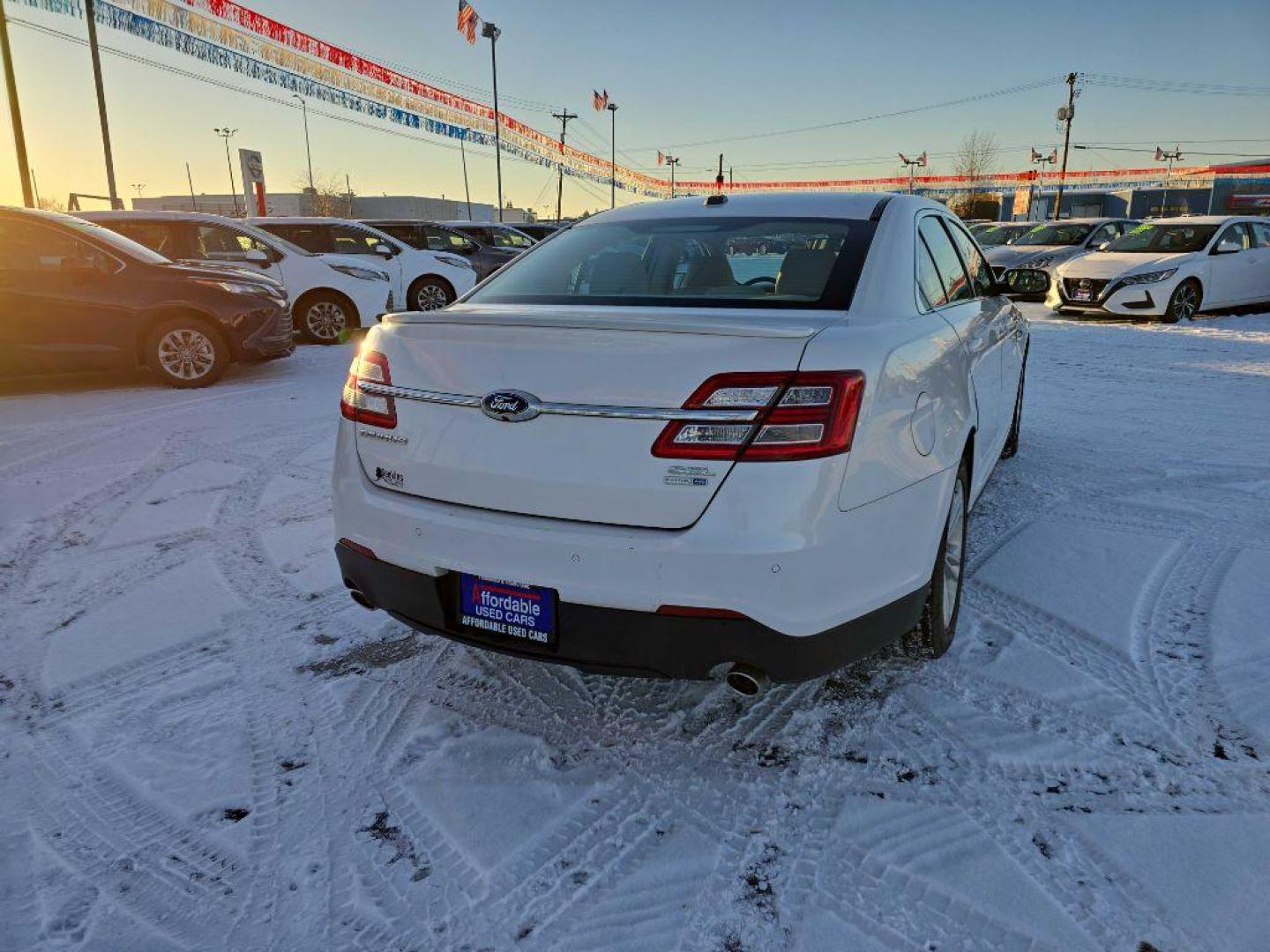 2015 WHITE FORD TAURUS SEL (1FAHP2H82FG) with an 3.5L engine, Automatic transmission, located at 2525 S. Cushman, Fairbanks, AK, 99701, (907) 452-5707, 64.824036, -147.712311 - Photo#2