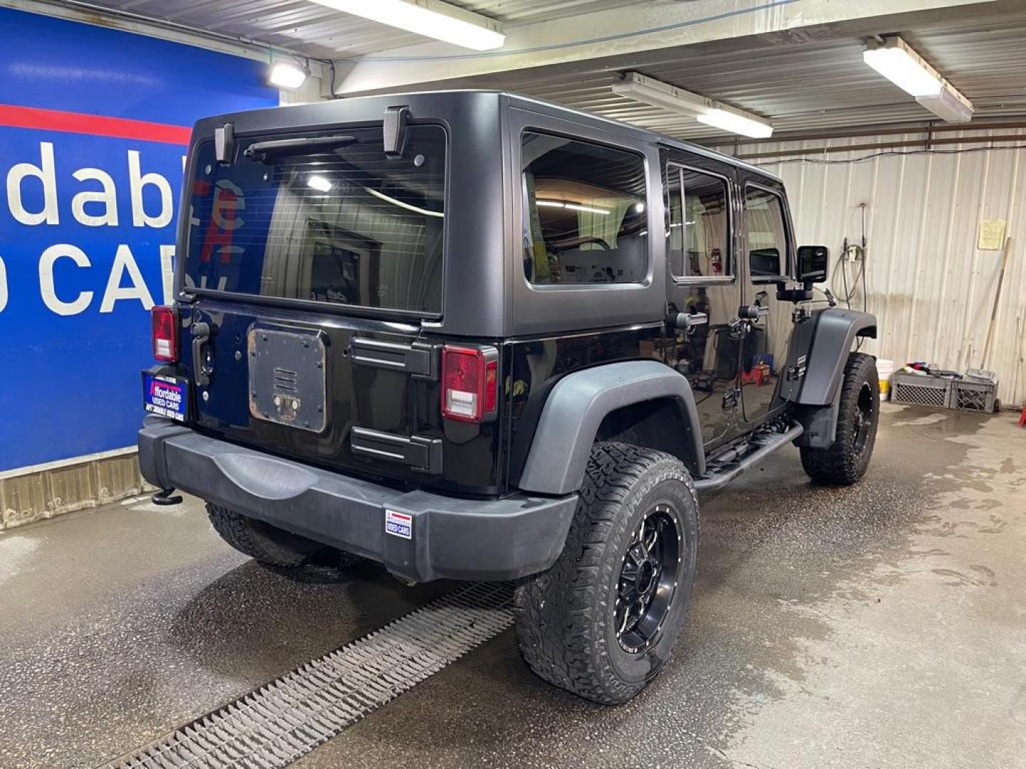 2016 BLACK JEEP WRANGLER UNLIMI SPORT (1C4BJWDG3GL) with an 3.6L engine, 5-Speed Manual transmission, located at 2525 S. Cushman, Fairbanks, AK, 99701, (907) 452-5707, 64.824036, -147.712311 - Photo#2