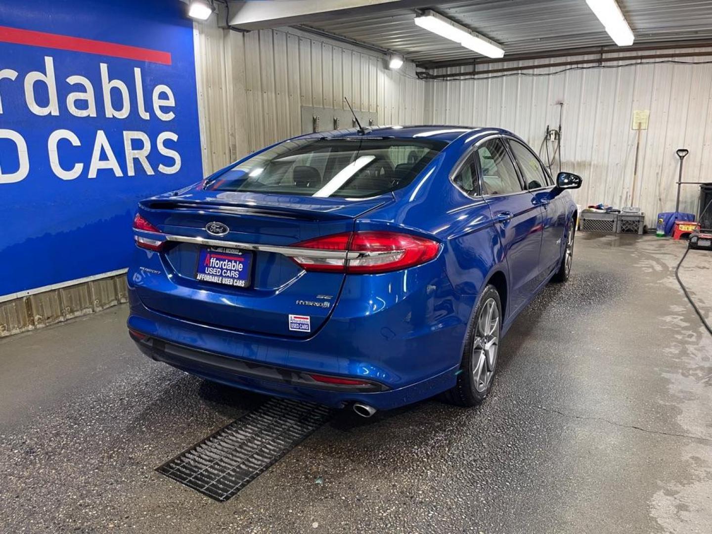 2017 BLUE FORD FUSION SE HYBRID (3FA6P0LU2HR) with an 2.0L engine, Continuously Variable transmission, located at 2525 S. Cushman, Fairbanks, AK, 99701, (907) 452-5707, 64.824036, -147.712311 - Photo#2