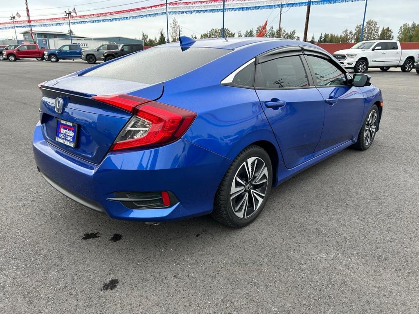 2017 BLUE HONDA CIVIC EX-T (2HGFC1E30HH) with an 1.5L engine, 6-Speed Manual transmission, located at 2525 S. Cushman, Fairbanks, AK, 99701, (907) 452-5707, 64.824036, -147.712311 - Photo#2