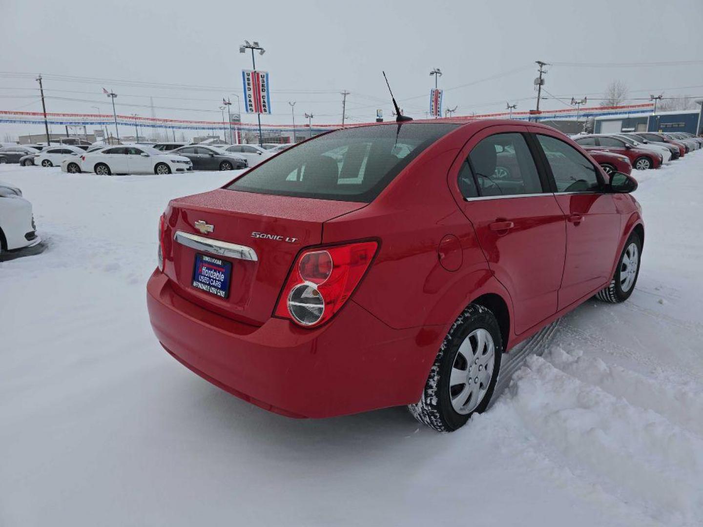 2013 RED CHEVROLET SONIC LT (1G1JC5SH4D4) with an 1.8L engine, Automatic transmission, located at 2525 S. Cushman, Fairbanks, AK, 99701, (907) 452-5707, 64.824036, -147.712311 - Photo#2