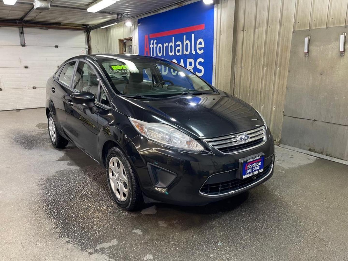 2011 BLACK FORD FIESTA SE (3FADP4BJ0BM) with an 1.6L engine, Automatic transmission, located at 2525 S. Cushman, Fairbanks, AK, 99701, (907) 452-5707, 64.824036, -147.712311 - Photo#0