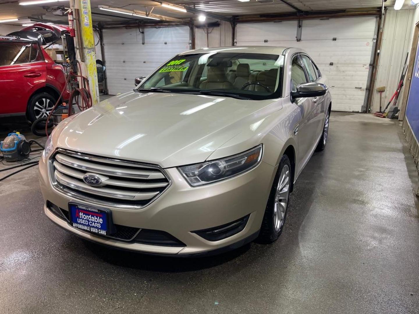 2017 GOLD FORD TAURUS LIMITED (1FAHP2F84HG) with an 3.5L engine, Automatic transmission, located at 2525 S. Cushman, Fairbanks, AK, 99701, (907) 452-5707, 64.824036, -147.712311 - Photo#1