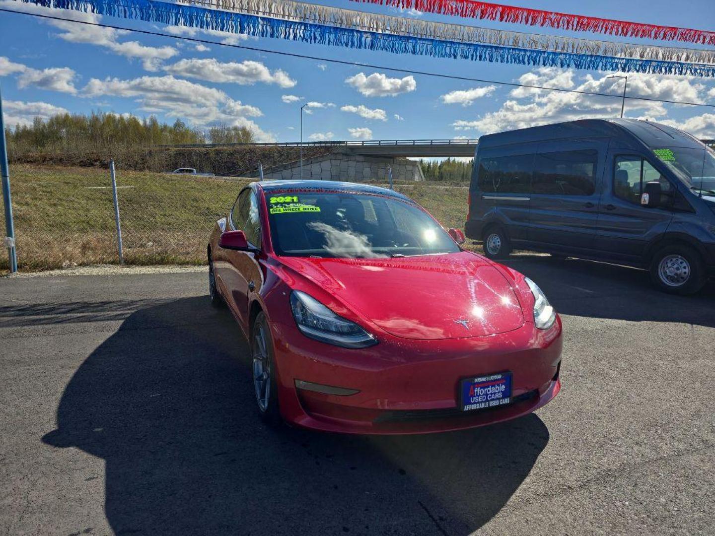 2021 RED TESLA MODEL 3 (5YJ3E1EB5MF) , Continuously Variable transmission, located at 2525 S. Cushman, Fairbanks, AK, 99701, (907) 452-5707, 64.824036, -147.712311 - Photo#1