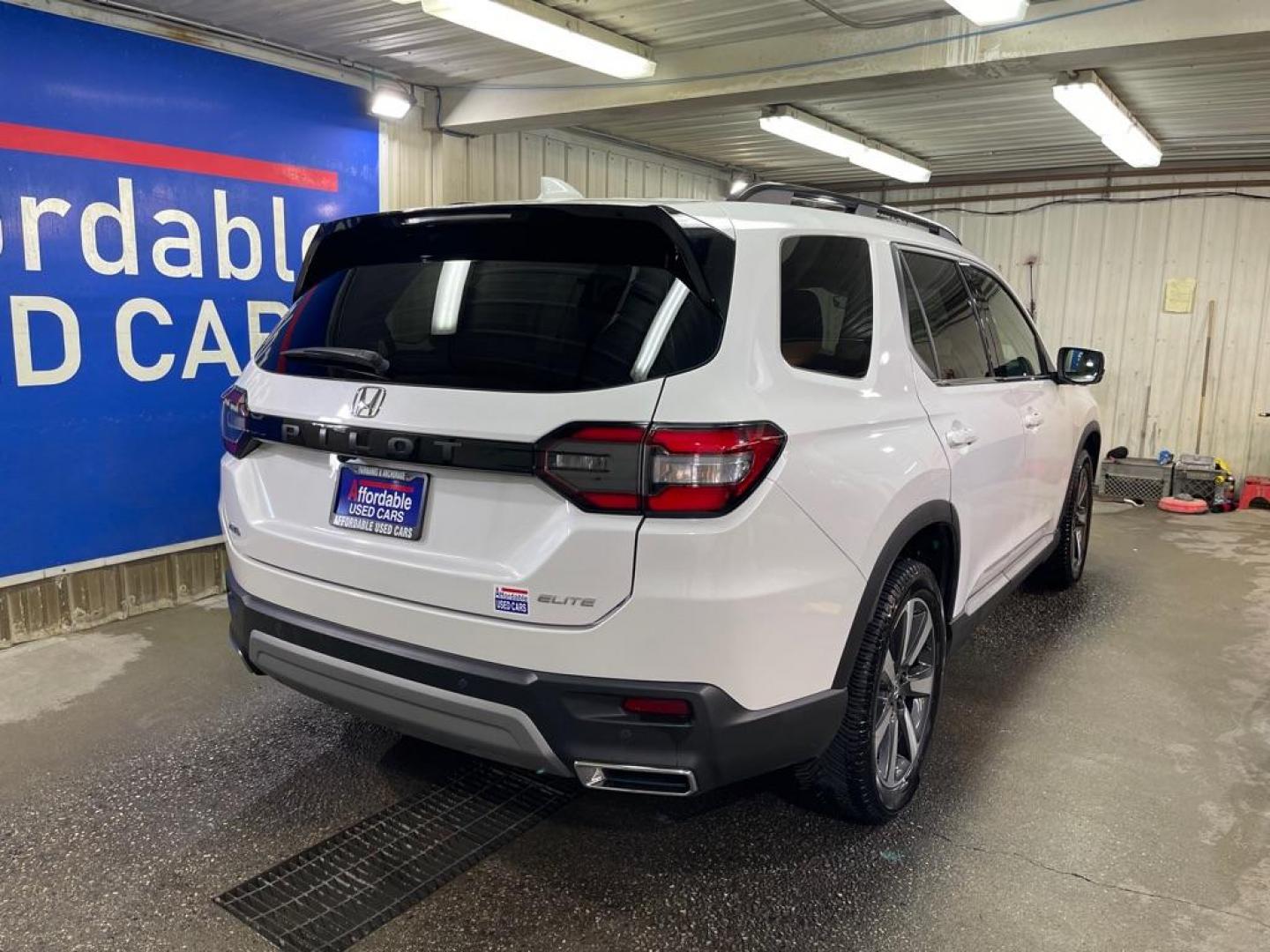 2023 WHITE HONDA PILOT ELITE (5FNYG1H80PB) with an 3.5L engine, Automatic transmission, located at 2525 S. Cushman, Fairbanks, AK, 99701, (907) 452-5707, 64.824036, -147.712311 - Photo#2