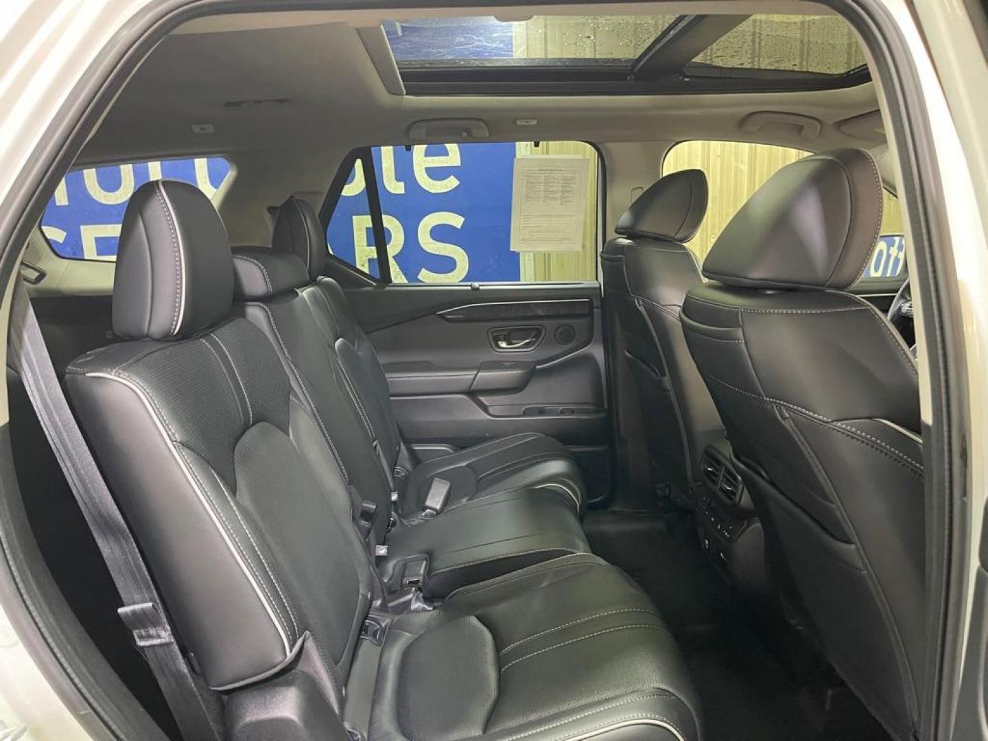 2023 WHITE HONDA PILOT ELITE (5FNYG1H80PB) with an 3.5L engine, Automatic transmission, located at 2525 S. Cushman, Fairbanks, AK, 99701, (907) 452-5707, 64.824036, -147.712311 - Photo#4