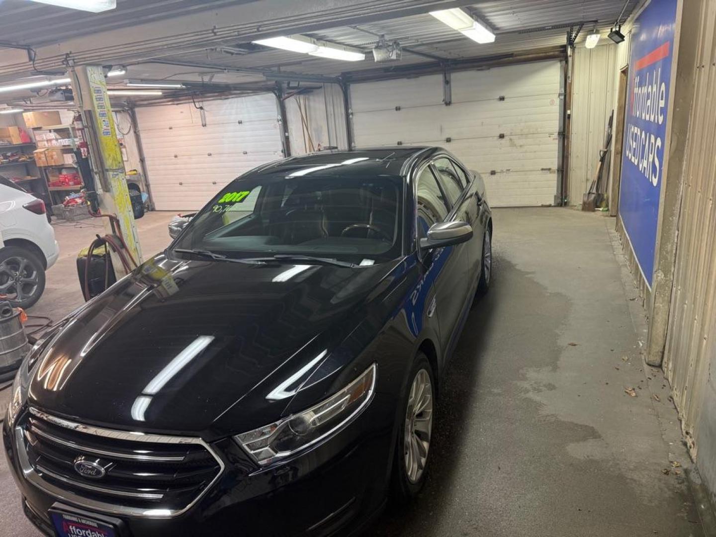 2017 BLACK FORD TAURUS LIMITED (1FAHP2F98HG) with an 2.0L engine, Automatic transmission, located at 2525 S. Cushman, Fairbanks, AK, 99701, (907) 452-5707, 64.824036, -147.712311 - Photo#1