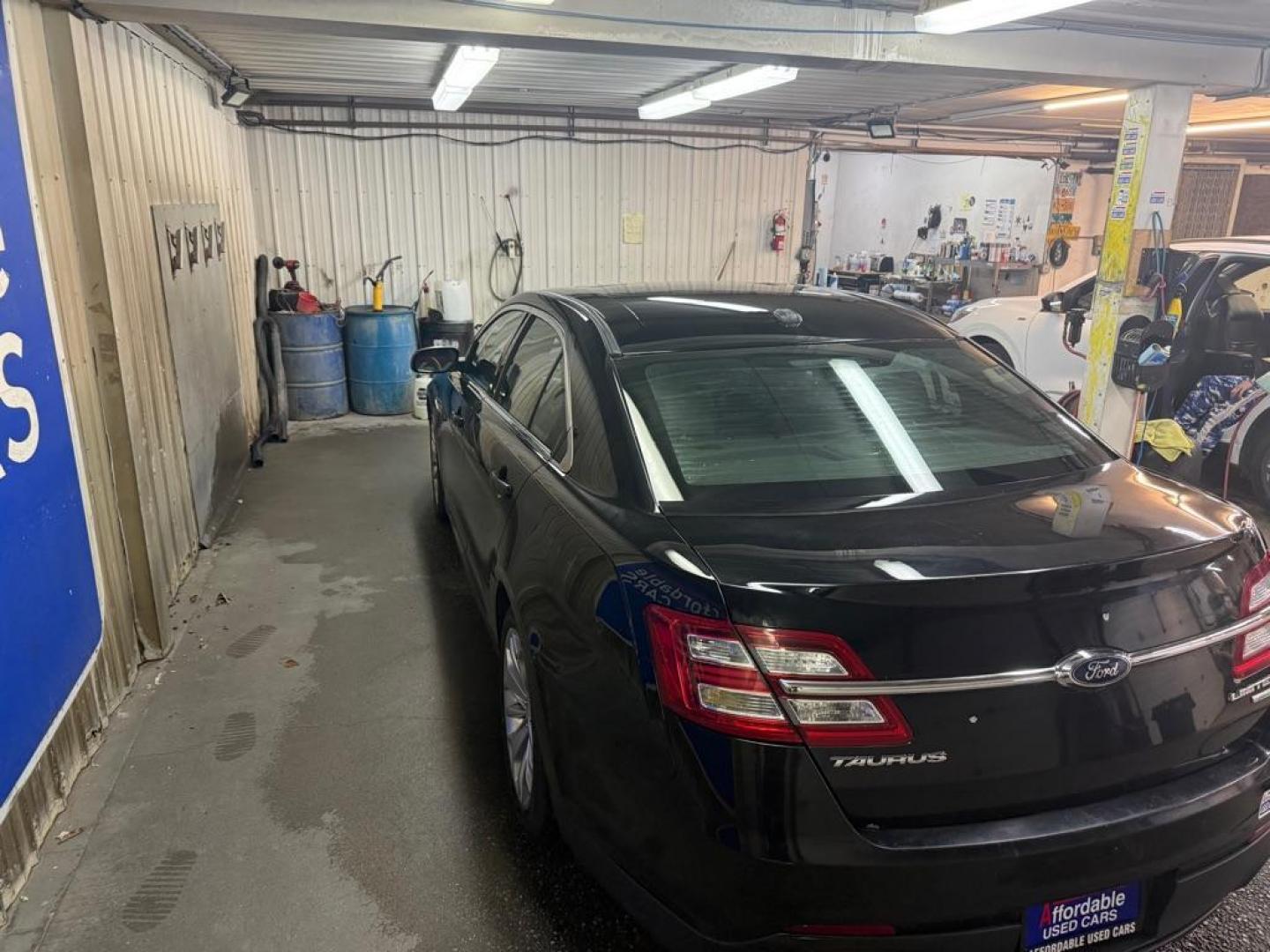 2017 BLACK FORD TAURUS LIMITED (1FAHP2F98HG) with an 2.0L engine, Automatic transmission, located at 2525 S. Cushman, Fairbanks, AK, 99701, (907) 452-5707, 64.824036, -147.712311 - Photo#2