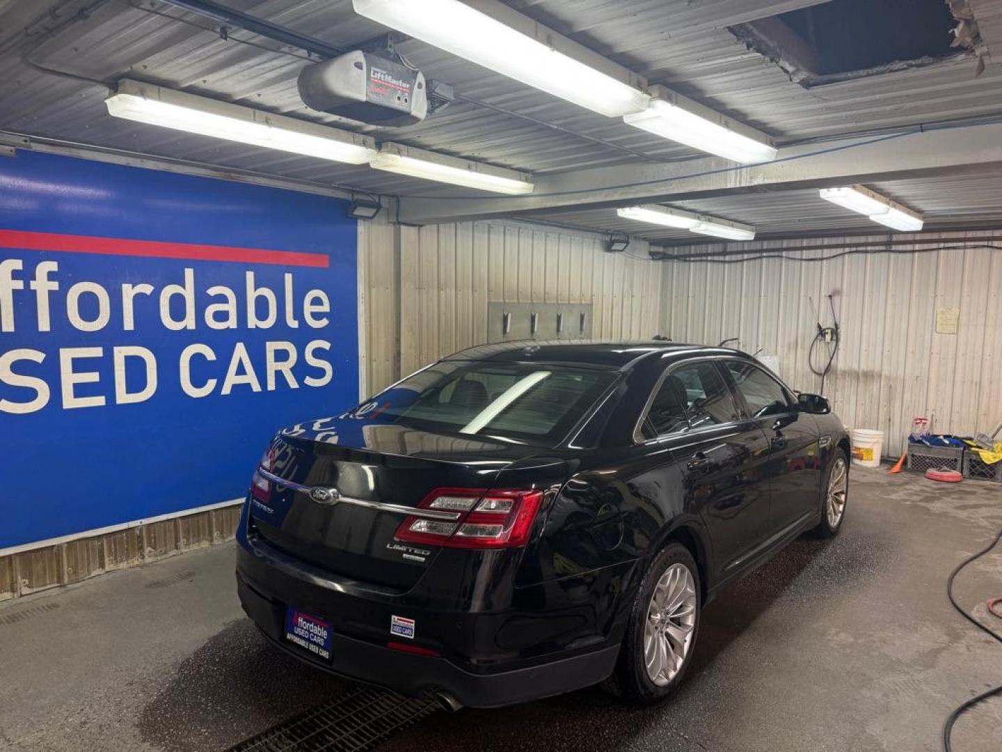 2017 BLACK FORD TAURUS LIMITED (1FAHP2F98HG) with an 2.0L engine, Automatic transmission, located at 2525 S. Cushman, Fairbanks, AK, 99701, (907) 452-5707, 64.824036, -147.712311 - Photo#3