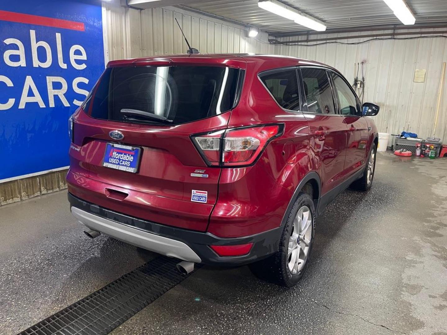 2017 RED FORD ESCAPE SE (1FMCU9G97HU) with an 2.0L engine, Automatic transmission, located at 2525 S. Cushman, Fairbanks, AK, 99701, (907) 452-5707, 64.824036, -147.712311 - Photo#2