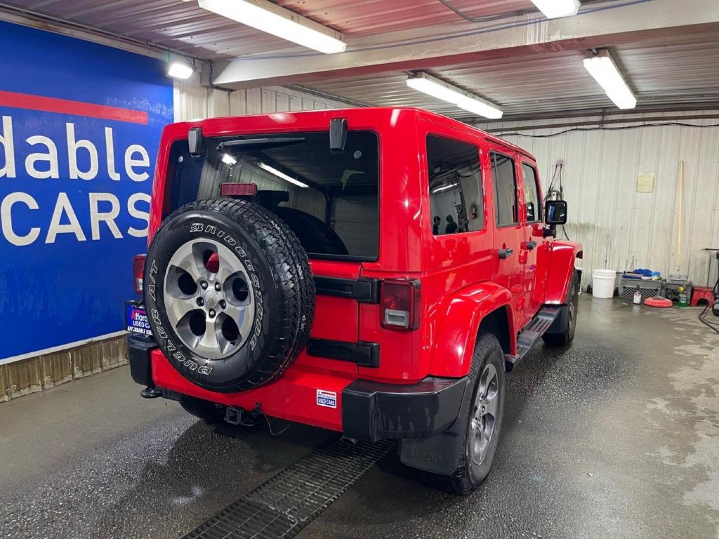 2016 RED JEEP WRANGLER UNLIMI SAHARA (1C4BJWEG2GL) with an 3.6L engine, Automatic transmission, located at 2525 S. Cushman, Fairbanks, AK, 99701, (907) 452-5707, 64.824036, -147.712311 - Photo#2