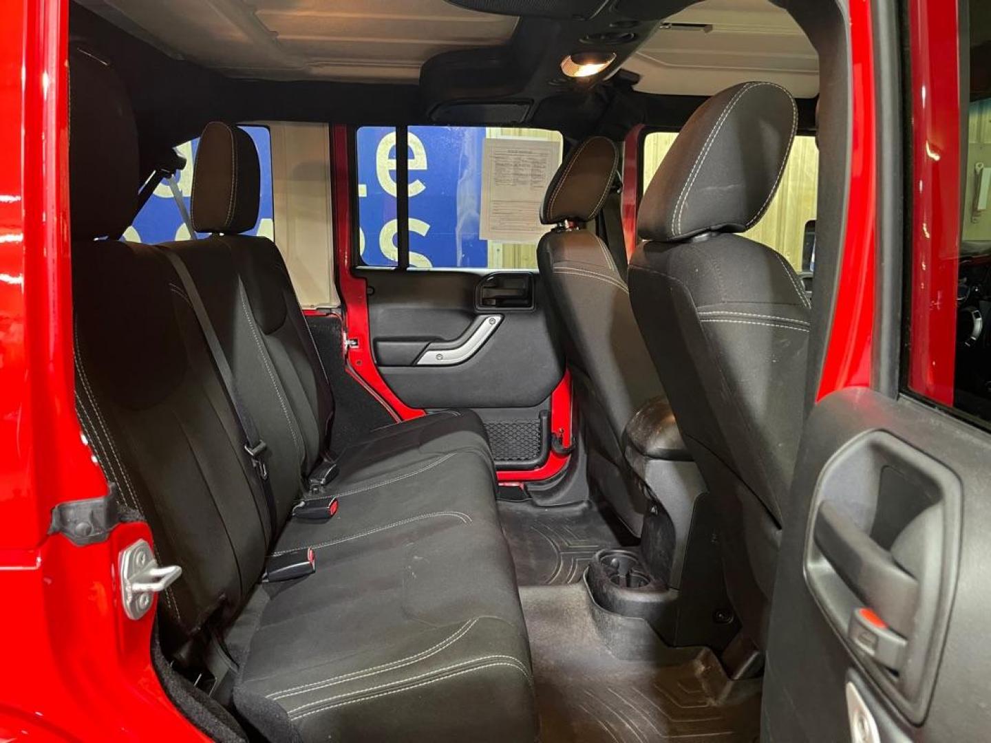 2016 RED JEEP WRANGLER UNLIMI SAHARA (1C4BJWEG2GL) with an 3.6L engine, Automatic transmission, located at 2525 S. Cushman, Fairbanks, AK, 99701, (907) 452-5707, 64.824036, -147.712311 - Photo#4