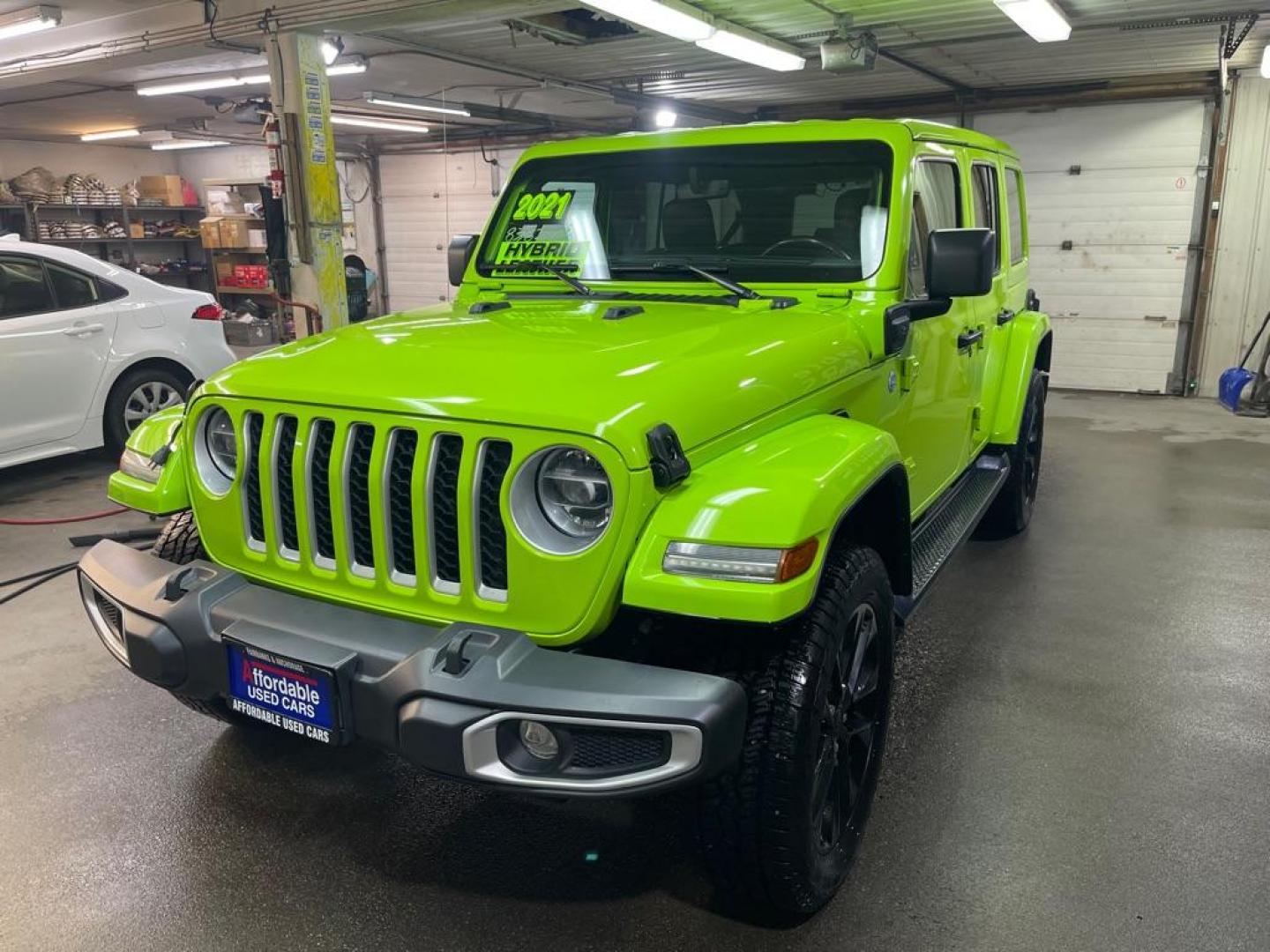 2021 GREEN JEEP WRANGLER UNLIMI SAHARA 4XE (1C4JJXP62MW) with an 2.0L engine, Automatic transmission, located at 2525 S. Cushman, Fairbanks, AK, 99701, (907) 452-5707, 64.824036, -147.712311 - Photo#1