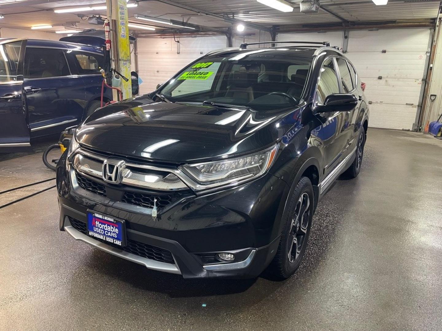 2017 BLACK HONDA CR-V TOURING (2HKRW2H94HH) with an 1.5L engine, Continuously Variable transmission, located at 2525 S. Cushman, Fairbanks, AK, 99701, (907) 452-5707, 64.824036, -147.712311- Photo#1