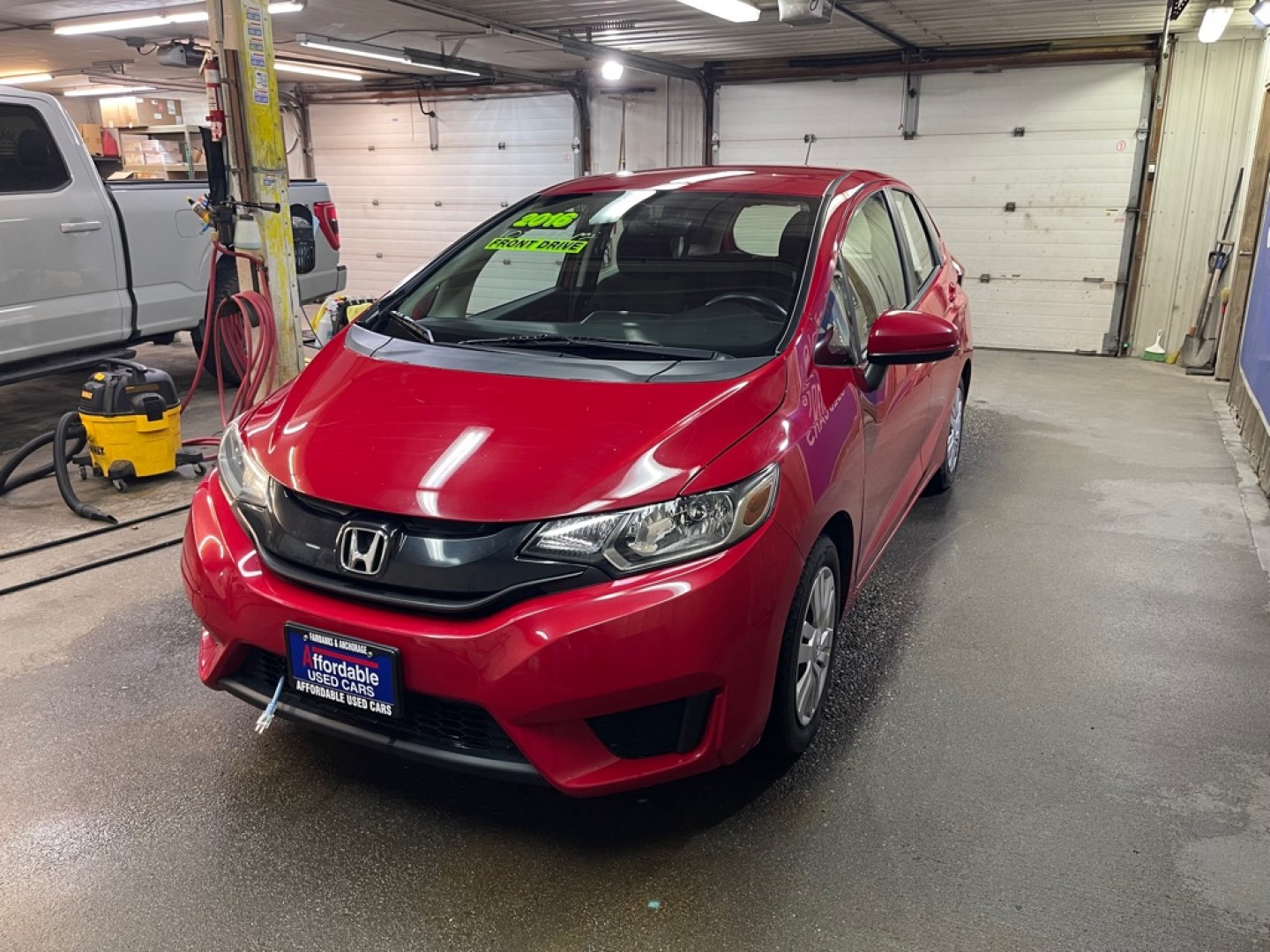 2016 RED HONDA FIT LX (JHMGK5H58GX) with an 1.5L engine, Continuously Variable transmission, located at 2525 S. Cushman, Fairbanks, AK, 99701, (907) 452-5707, 64.824036, -147.712311- Photo#1