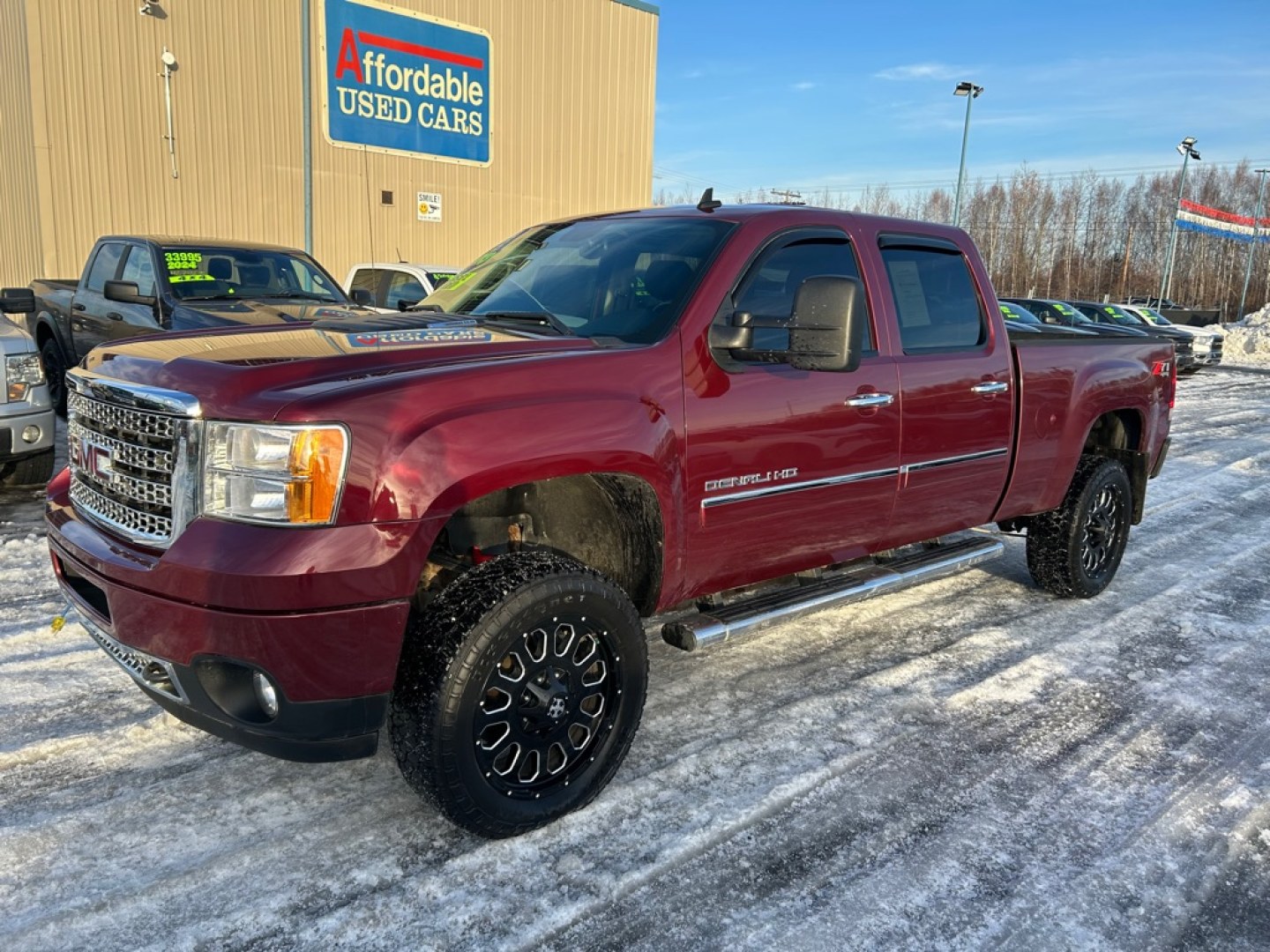 2013 MAROON GMC SIERRA 2500 DENALI (1GT125E80DF) with an 6.6L engine, Automatic transmission, located at 2525 S. Cushman, Fairbanks, AK, 99701, (907) 452-5707, 64.824036, -147.712311- Photo#0